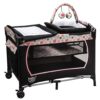 Baby Joy 4-in-1 Pack and Play with Bassinet, Changing Table, Toys, and Music - Pink